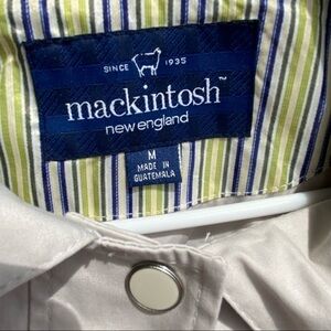 Mackintosh rain jacket with Detachable hood and large pockets. Preppy gear.